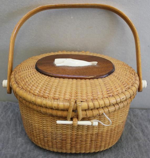 WHITTEN, Paul F. Nantucket Basket Purse.: Signed and dated 1980. With the original bill of sale. From a Shelton, CT home. Dimensions: 16.5" wide x 11" high (not including handle). Condition: One minor interior cane loose.