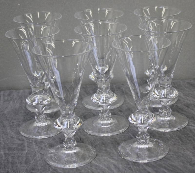 STEUBEN. 8 Pieces of Stemware and Set of 8 Finger: Bowls. In original Box. From a Westport, CT home. Dimensions: Glasses 6" high; bowls 4.5 diameter x 2.125 high.
