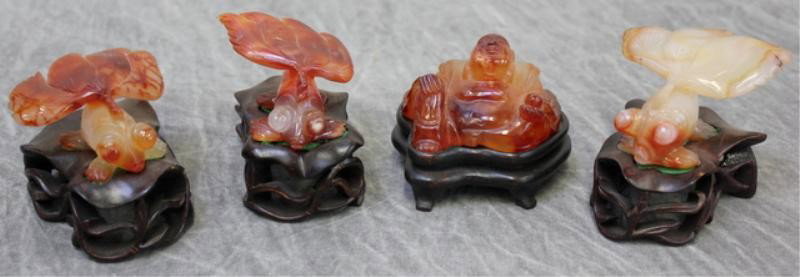 Lot of Carnelian Figures Including 3 Coy Fish and: 1 Buddha all on Hardwood Bases. From a NYC apartment. Dimensions: Approx. 3" x 2.25" including bases.