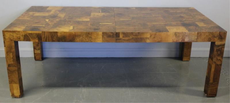 Paul Evans. Midcentury Dining Table.: Beautiful burl wood patchwork dining table with two original skirted leafs. Labeled. From a Long Island, NY estate. Dimensions: 84" wide x 40" deep x 29" high. Leaf width - 15." Condition: Some small