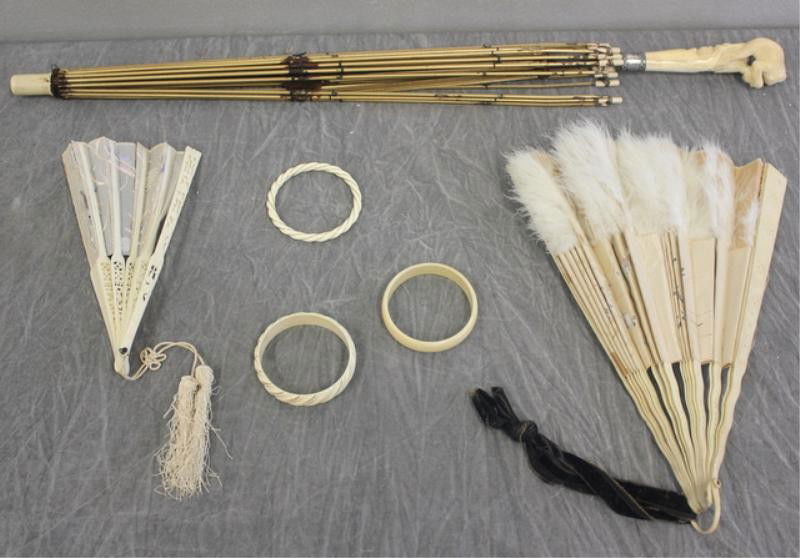Ivory Lot. Includes Carved Monkey Handle Parasol: Frame with Sterling Ferule. Also, 3 bangle bracelets - one bangle marked on the inside with a plaque reading "14k" - one strip of gold missing. One other bangle with gold wire marked on the inside "14