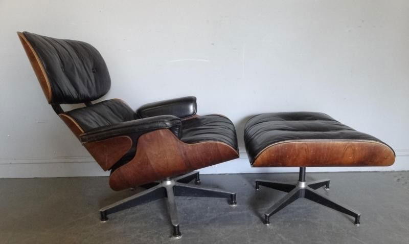 Charles Eames. Lounge Chair and Ottoman.: A nice early piece with down filling. From a Fairfield, CT estate. Dimensions: chair - 33" x 33" x 32" high, ottoman - 21" x 26" x 16" high. Condition: a button has pulled through the leather on the s