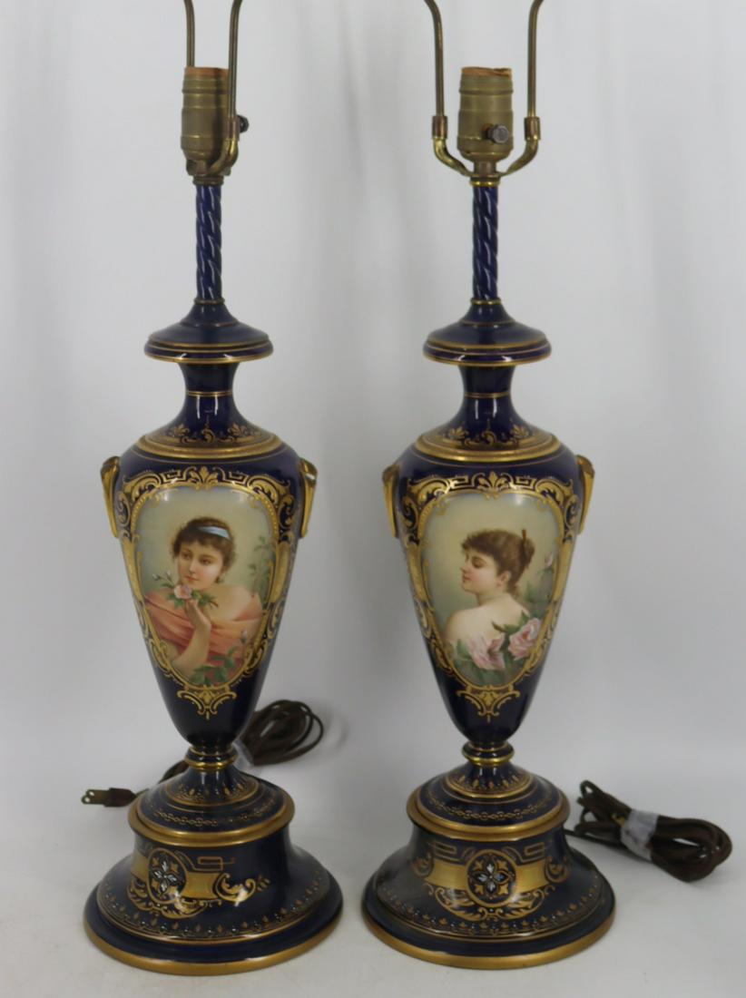 A Pair of Royal Vienna Lamps (Attrib): Signed "C. Heer" Each lamp showing a portrait of a lovely woman. Possible restoration / damage to the handle areas. From a Hawthorne, NY estate. - Dimensions: 12" vase, 33" h overall.