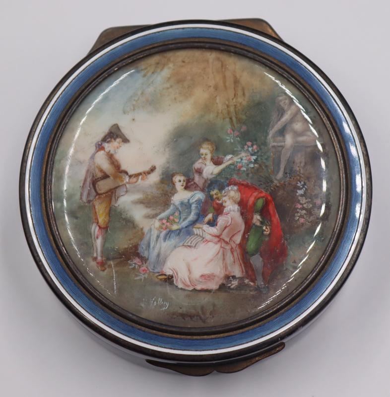 SILVER. Alphonse Debain .950 Silver and Enamel: Circular Box. Signed Alphonse Debain French .950 silver circurlar hinged box with blue guilloche enamel decoration and central signed painted portrait of ladies in a garden with a musician. Gold wash
