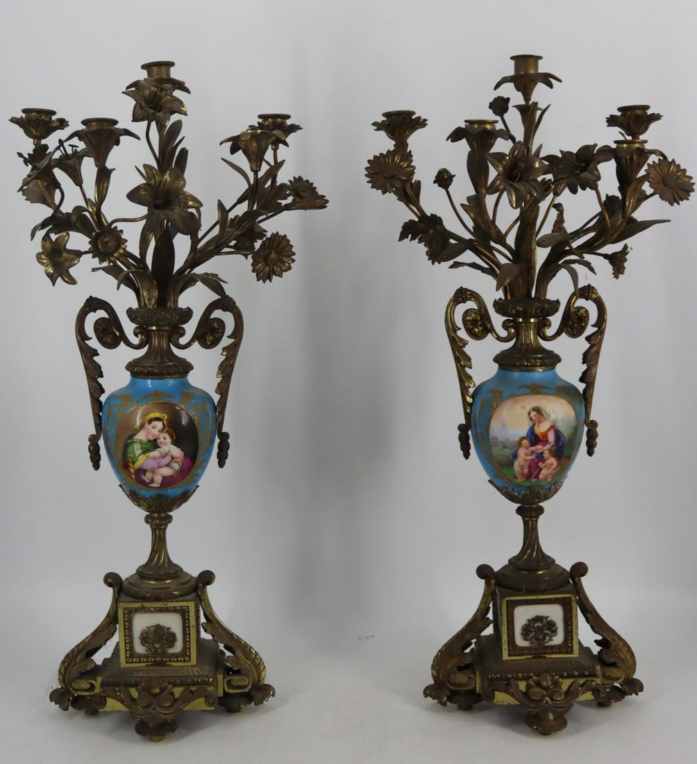 An Antique Pr Of Bronze Sevres Style Candelabra.: Nice quality with porcelain centers. From a Wallingford, CT estate. - Dimensions: 27.25" h x 13.4" w x 10" d.