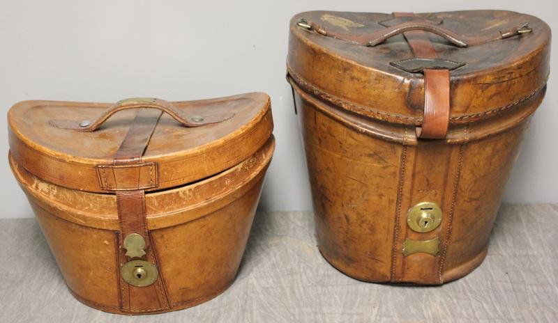 2 Leather Hat Boxes.: 1 monogrammed R.J.B.N. - 13.5" wide x 12" deep x 13.5" high; Other - 13.5" wide x 12" deep x 9.5" high. From an attorney's 230 Park Avenue NYC estate.