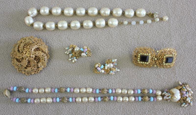 Vintage Costume Jewelry Lot Including Haskell.: Includes a Miriam Haskell large faux pearl necklace; a Haskell necklace and earring set with faux pearls, and purple and blue beads; and a Haskell brooch with missing stones. Also includes a Hobe hair