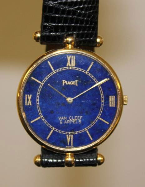 PIAGET. Mens 18kt Gold Watch.: Was retailed by Van Cleef & Arpels - as indicated on dial. Case is marked on the inside of back "18K" and "750." Beautiful blue lapis lazuli face, and solid 18kt case and back. Movement is original an
