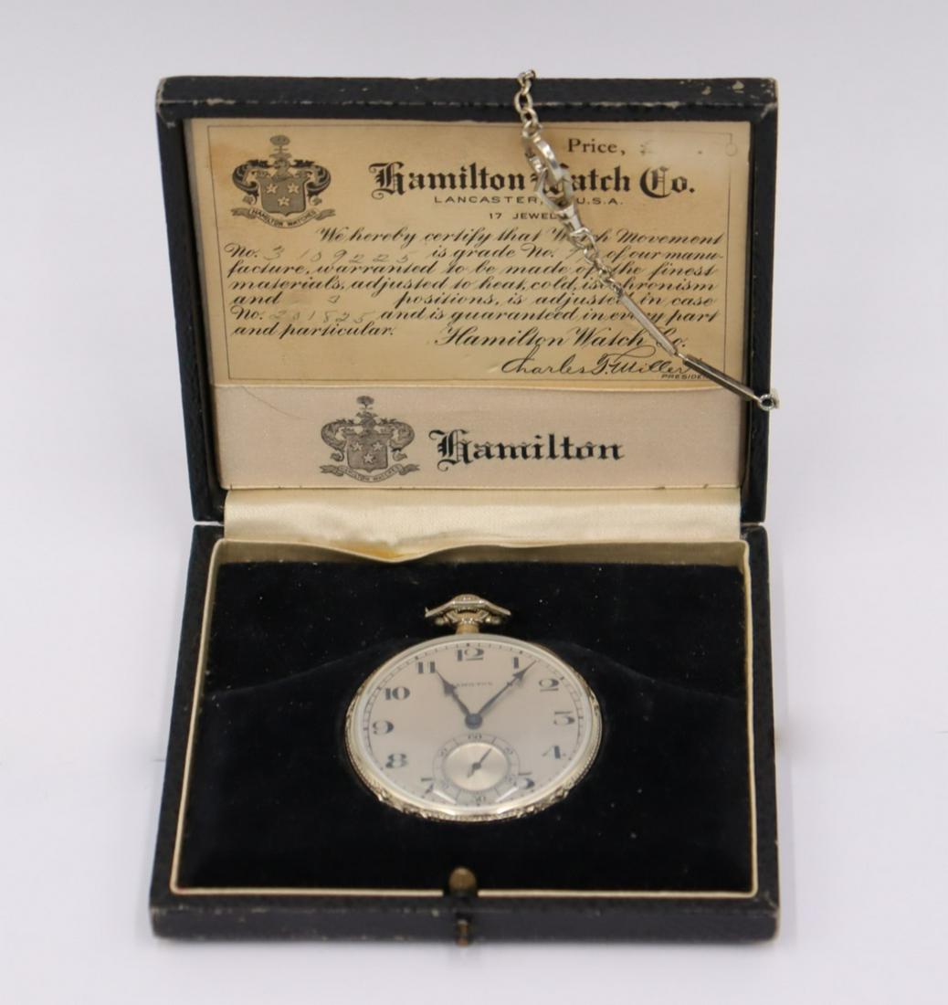 JEWELRY. Hamilton 14kt Gold Open Face Pocket Watch: A Hamilton 14kt white gold open face pocket watch. This pocket watch by Hamilton manufactured in approx. 1924 (based on movement serial #:3109225) features an ornately decorated 14kt white gold open f