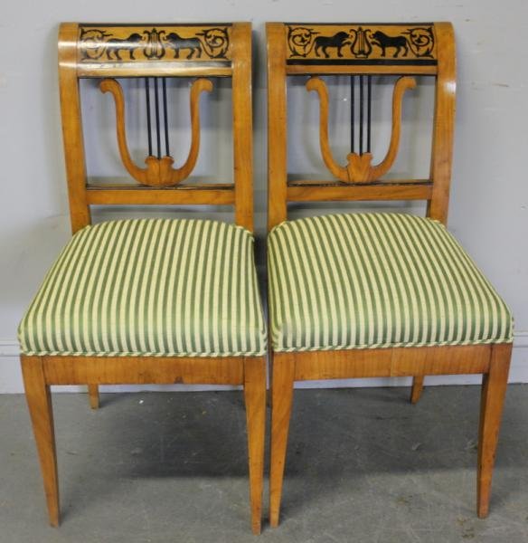 Pair of Biedermeier Upholstered Side Chairs.: A beautiful looking pair of chairs with lyre backs and black lacquer decoration. From a NYC estate. Dimensions: 16.5" wide x 17" x 35" high.