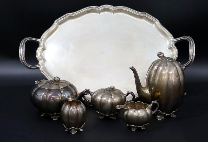 SILVER. (5) Pc. Netherlands .833 Silver Tea Set.: A spectacular (5) piece Netherlands Gerritsen en van Kempen N.V. .833 silver gourd form tea service comprised of teapot, coffee pot, lidded sugar, creamer, and open waste vessel. All Items stamped ver