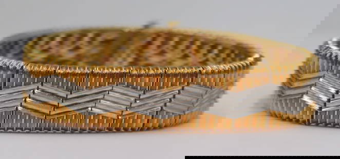 JEWELRY. Michael Bondanza "Heatwave" 18kt Gold and: Platinum Bracelet. Signed Michael Bondanza "Heatwave" 18kt gold articulated link bracelet with central platinum wave form accents. Stamped, "Plat Redefined 18K Bondanza" with a pic