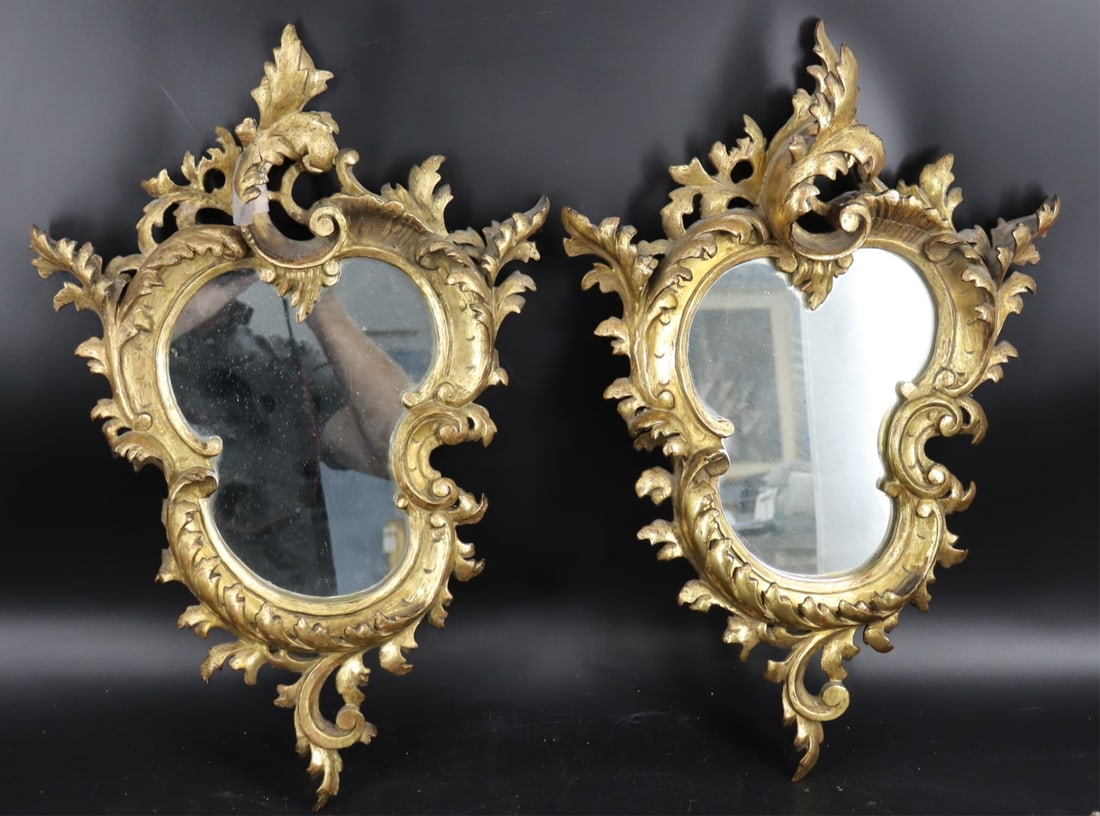 A Pair Of French Louis XV Style Carved Giltwood: Mirrors. With a Salon Paris label on back. From a Chappaqua, NY home. - Dimensions: 21" h x 14" w.
