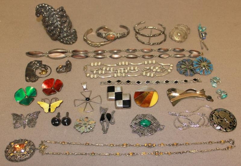 Large Lot of Vintage Sterling Jewelry.: Includes a Mexican cuff bracelet; a Mexican cat pin with fish; 3 Norweigan sterling and enamel pins including David Anderson; Orville Tsiman bracelet; Cat with fish pin - Marked "Pazia," 14kt and ster