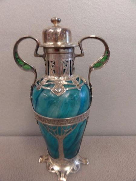 Art Nouveau Silver Mounted Loetz? Urn.: With enamel or plique a jour work in the handles. Marked underneath sterling .935. A beautiful and rare piece. From a Scarsdale, NY home. Dimensions: 7.5" high.