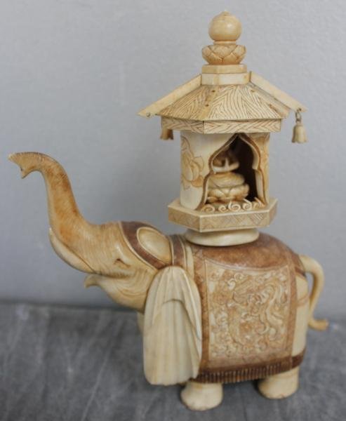 Asian Ivory Elephant with Buddhist Figure in: Temple on Top. From an East 77th St NYC estate. Dimensions: 9" high. Condition: Missing 3 roof ornaments and 4 bells.