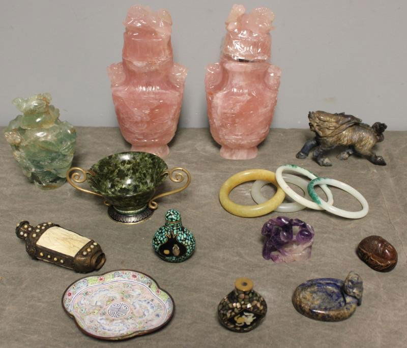 Asian Hardstone Lot.: Includes a serpentine cup mounted with brass handles and an enamel base; 4 jade bangle bracelets; a soapstone foo dog; an early signed enamel dish - as is on back; a sodalite owl ring tray; two pink q
