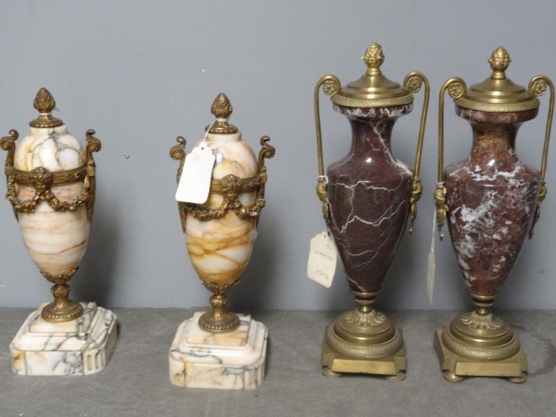 Antique Bronze and Marble Cassolette Lot: Includes pair of antique bronze and marble cassolettes, 14" high, with hairline and central rod bent on one. Also includes pair of vintage brass mounted brown marble cassolettes, 16" high. Condition: 
