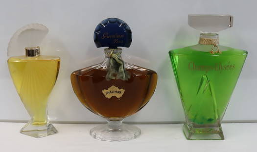3 Vintage & Large Advertising Perfume Bottles.: To include Shalimar, Fasson and Champs Elysee. From an Albertson Long Island, New York estate. - Dimensions: 14" h, 15" h & 15" h.