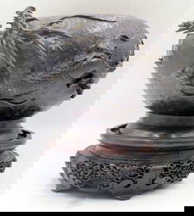 Japanese Bronze Planter with Dragon.: Japanese bronze planter displaying a high relief three-toed dragon clasping the flaming pearl within its claws. Accompanied by a carved wood stand. From a Bedford, NY estate. Dimensions: planter measu