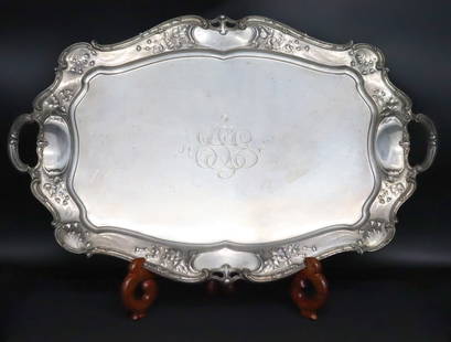 STERLING. Massive Gorham Sterling Drinks Tray.: A truly exceptional Gorham sterling large drinks tray. This tray by Gorham showcases an elegant border that seamlessly flows into its handles, creating a captivating presentation. It boasts a beautifu
