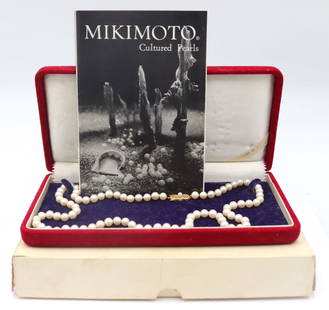 JEWELRY. Mikimoto Pearl and 18kt Gold Necklace.: Vintage Mikimoto necklace comprised of (84) individually knotted cultured pearls with an 18kt yellow gold clasp with a single round pearl accent. Pearls measure approx. 6.0mm each. Clasp is stamped, &