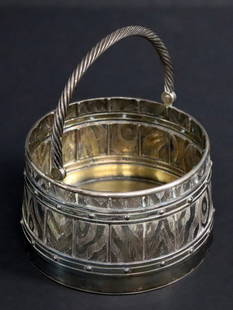 SILVER. Spectacular Russian Ivan Khlebnikov .875: Silver Basket. A truly exceptional Russian .875 silver barrel-shaped swing-handle basket. This basket intricately portrays a lifelike barrel with wood grain slats, hoops, rivets, and a handle in the f