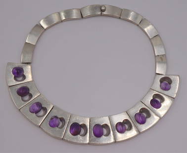 JEWELRY. Attr. to Antonio Pineda .970 Silver and: Amethyst Collar Necklace. Attributed to Antonio Pineda .970 silver collar form necklace comprised of (10) tapered links displaying oval amethyst cabochons and mirrored pierced openings. Amethyst caboc