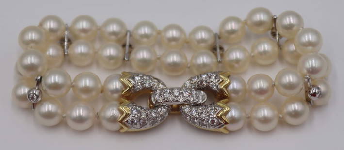 JEWELRY. Cartier 18kt Bi-color Gold, Pearl and: Diamond Bracelet. Signed Cartier double strand pearl bracelet with an 18kt bi-color gold clasp inlaid throughout with pave diamonds and further accented by (6) 18kt white gold spacers displaying singl