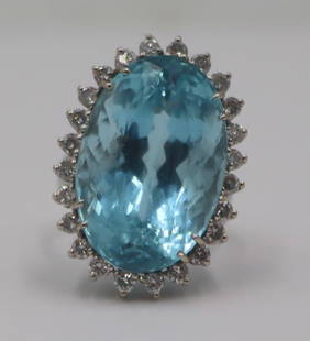 JEWELRY. GIA 25+ ct Aquamarine and Diamond Ring.: 14kt white gold cocktail ring displaying a central prong-set oval faceted aquamarine with a surround of (24) round full cut diamonds. Accompanied by a November 22nd, 2023 GIA Identification Report no.