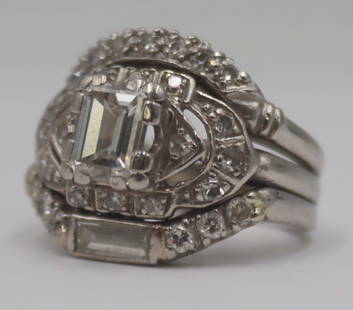 JEWELRY. Platinum and 1.10 Emerald Cut Diamond: Ring. Platinum engagement ring featuring a central 1.10 ct emerald cut diamond (14) round single cut diamonds - stamped, "Plat" to the interior of the band. Center diamond is accompanied by a November