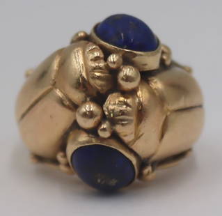 JEWELRY. 14kt Gold and Lapis Lazulis Scarab Ring.: Egyptian Revival 14kt yellow gold ring displaying (2) scarabs flanked by (2) bezel set Lapis Lazulis oval cabochons. Cabochons measure approx. 9.0mm x 7.0mm. Stamped, "14K". Ring size - 9. Total appro