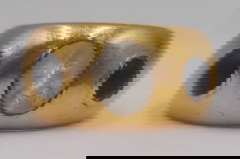 JEWELRY. 18kt Gold, Moonstone and Gem Ring.: 18kt yellow gold wide band ring displaying a central oval carved moonstone displaying a face flanked by round blue gem cabochons. Moonstone measures approx. 6.5mm x 8.0mm. Apparently unmarked. Total a