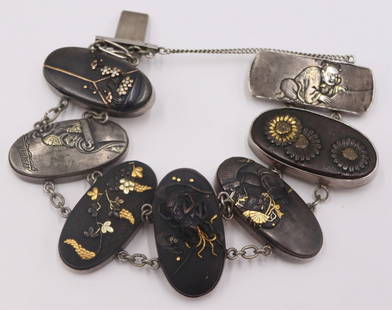 JEWELRY. Japanese Mixed Metal Shakudo Bracelet.: Japanese Shakudo bracelet comprised of (6) silver mounted mixed metal pendants displaying various scenes of flowers, figures and shrimp. With a silver clasp displaying a mixed metal depiction of a cro