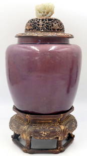 Chinese Aubergine Vase with Jade Finial.: Chinese Aubergine vase accompanied by a highly carved and gilt decorated lid and footed base. Lid is further accented by carved Chinese jade pendant of a beast surrounded by lingzhi. From a Bedford, N