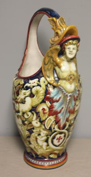 Antique Italian Cantagalli Faience Basket Form: Vase. Depicting cherubs, dragons, and other creatures. With cherub handle. Signed on bottom. From a Manhattan, NY estate. Condition: As is - with repair to break on bottom and glue residue.