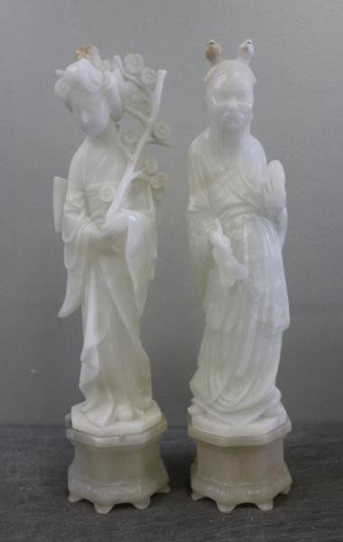 Pair of White Alabaster / Jadeite Asian Figures.: From a Garden City, NY location. Dimensions: Female - 20.25" high; Male - 20.5" high. Condition: As is - old repair to top; chips to feet on base.