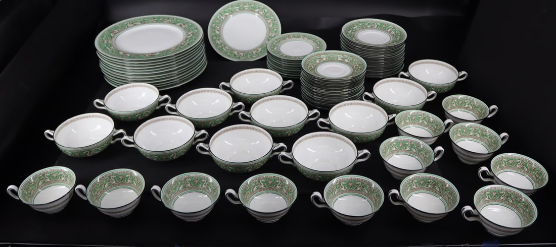 A Large Set Of Wedgwood Florentine Green: To include 12 dinner plates (10.5"), 1 salad plate (8"), 9 bread plates (6"), 11 soup bowls (4.75"), 12 soup saucers (6.5"), 12 cup (2") and 12 saucers (5.75"). From