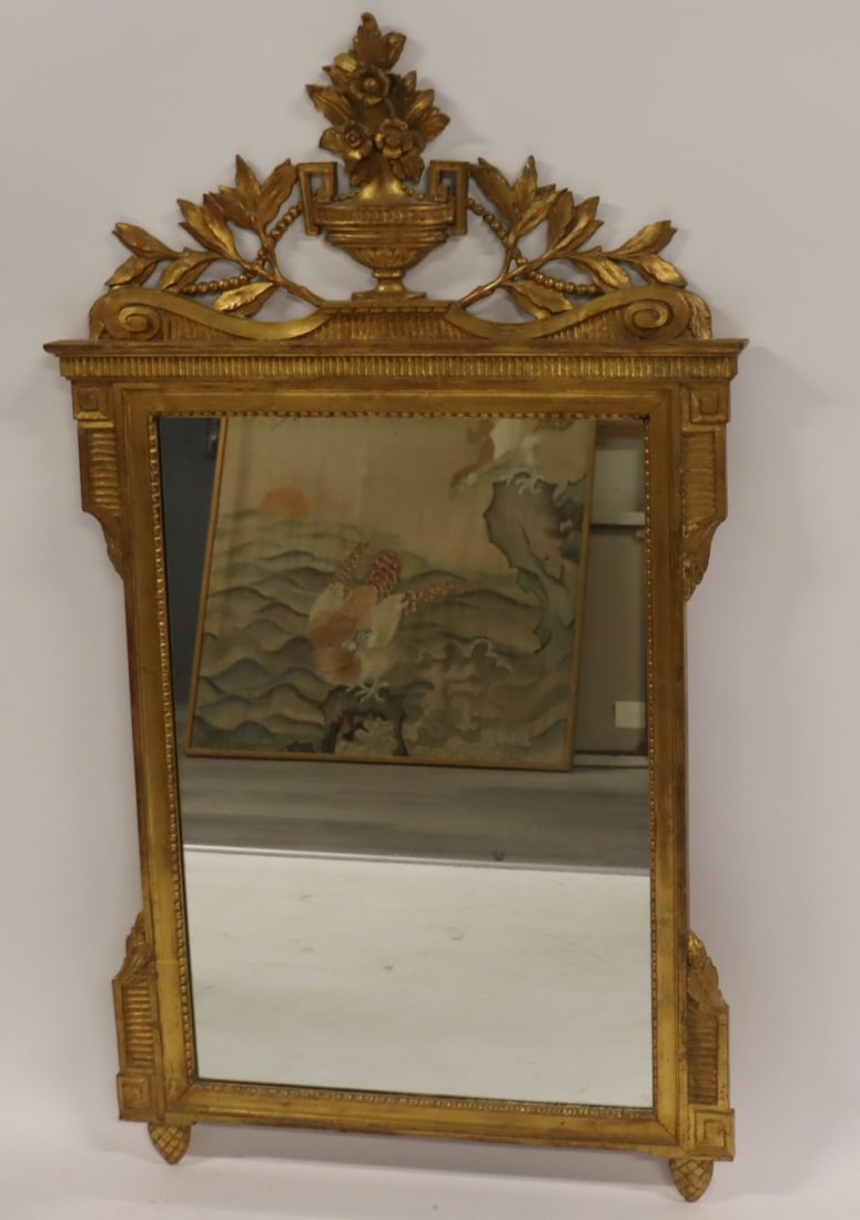 Vintage Giltwood Mirror With Urn Crown.: Good size with nice gilding and urn and flower crown and raised on Pineapple feet. From a Scarsdale NY estate. - Dimensions: 57" x 33"