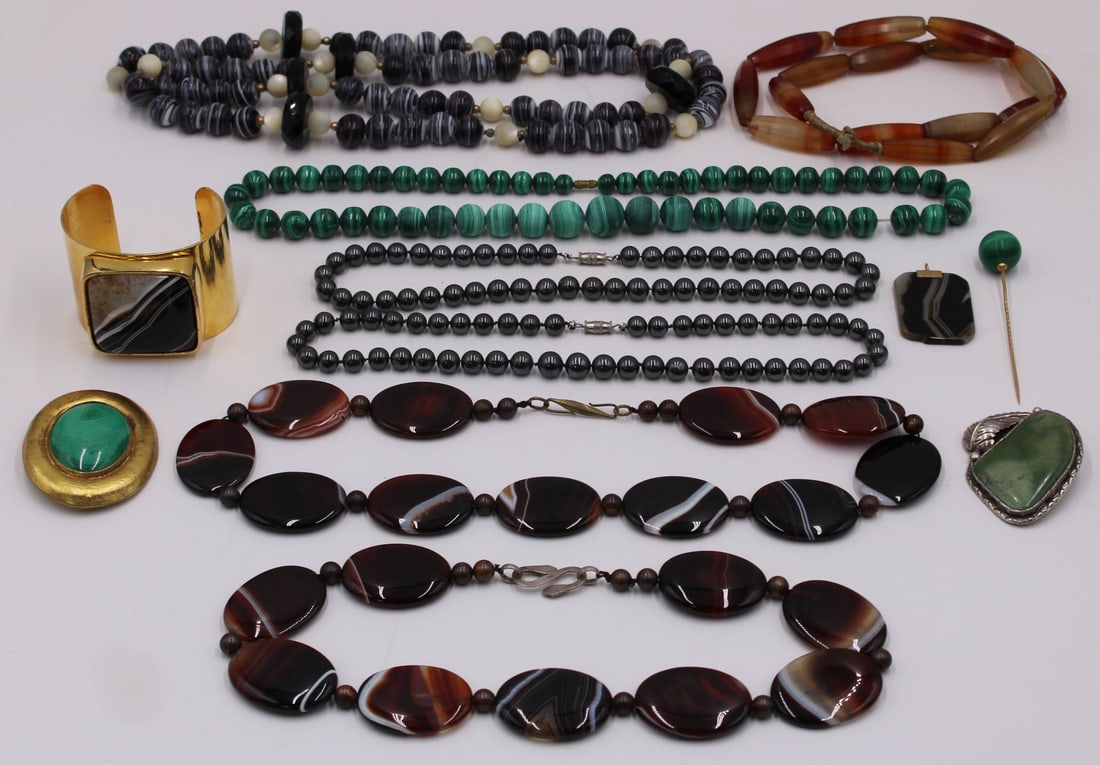 JEWELRY. Assorted Jewelry Inc. Malachite, Banded: Agate, and Carnelian. Includes a Southwest sterling and turquoise pendant - stamped, "Sterling L..." verso; an oval gilt sterling brooch displaying a malachite cabochon - stamped verso, &quo