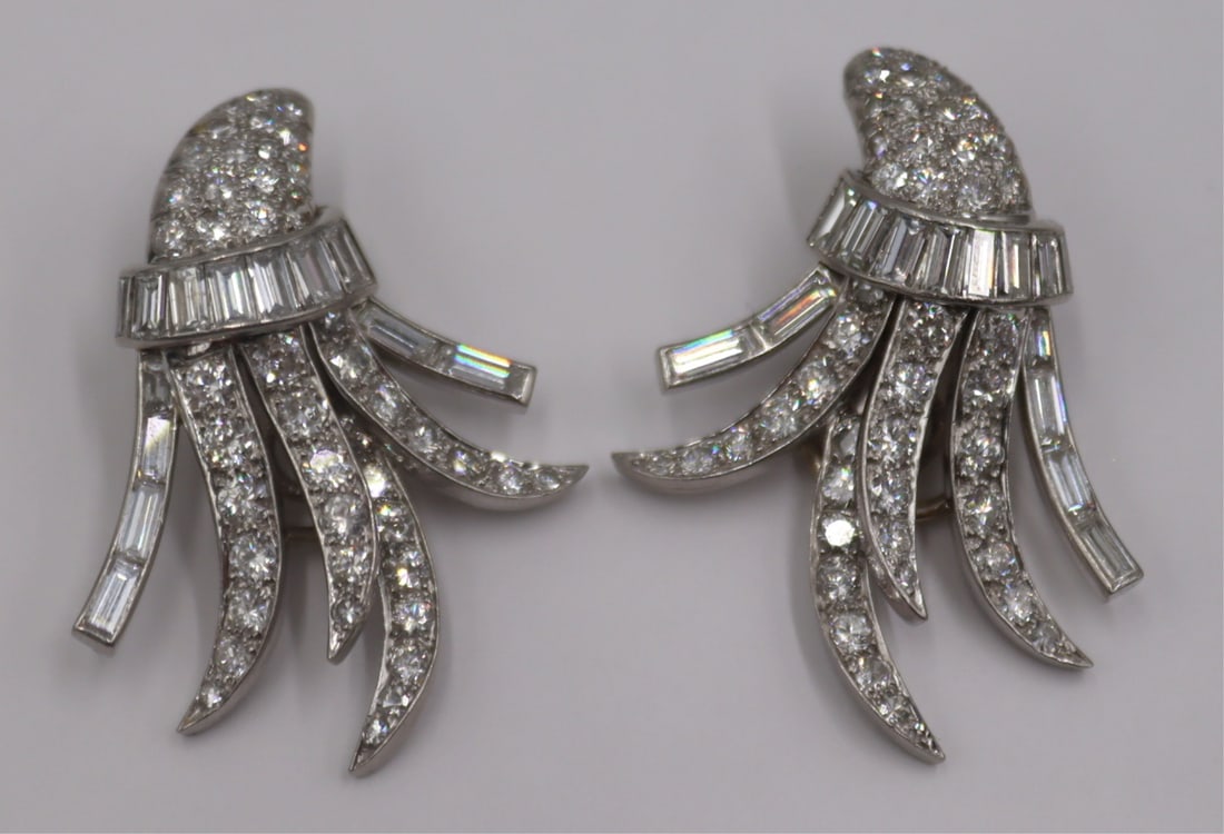 JEWELRY. Platinum and Diamond Spray Earrings.: Pair of platinum and diamond spray form earrings with 14kt white gold clip-on earring backings. Each individual earring is comprised of (14) straight diamond baguettes, and (44) round full and single 