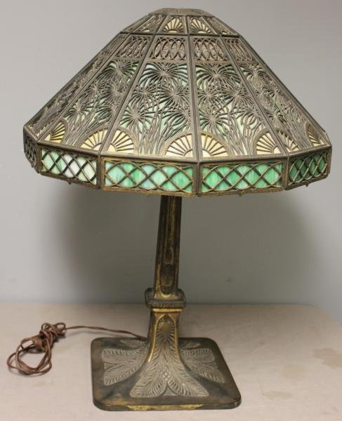 Large Antique Slag Glass Lamp.: With filigree shade. Interesting label "Patented Murano 1905." From a Yonkers, NY estate. Dimensions: 20" diameter x 30" high. Condition: One green panel with 2 cracks; finial is probably not original