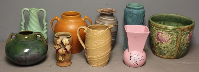 9 Piece Art Pottery Lot Including Fulper.: Includes a Fulper 2 handled vase - 6" h; an orange crackle glass vase with applied flowers - 6" h; an orange Pfalzgraff 2 handled vase - 8" h; an English brown pottery pitcher - 8" h; a matte green 2 