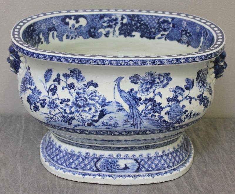 Antique Chinese Blue and White Porcelain Footbath.: Decorated with birds in a landscape. "Orange peel" bottom. From a Stamford, CT location. Dimensions: 14" wide x 10.5" deep x 9.25" high. Condition: Minor interior and exterior staining.