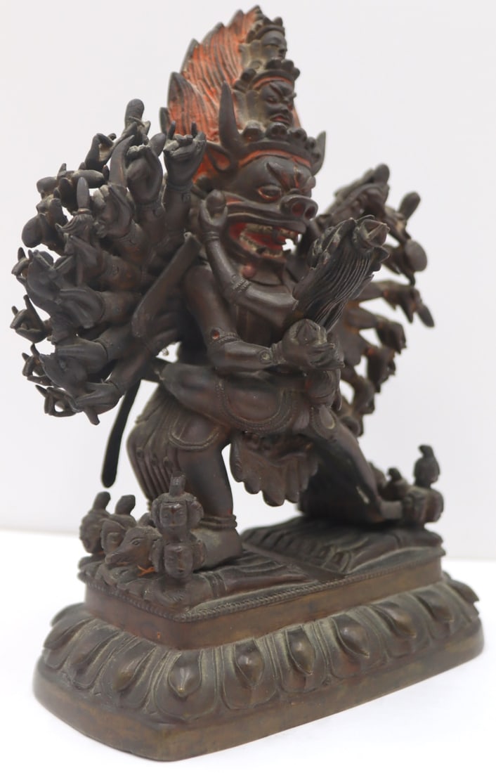 18th/19th C Tibetan Bronze Figure of Vajrabhairava: 18th/19th century Tibetan bronze figure of Vajrabhairava. Described as, "the deity, standing in alidhasaana, is trampling 10 nude, pregnant women, his central ferocious bull face. Thirty hands ho