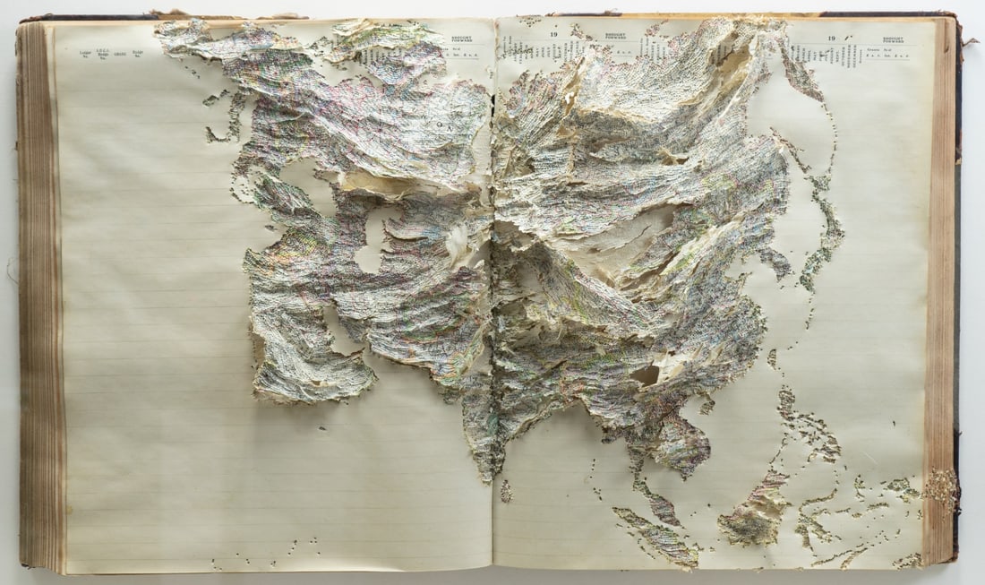 JONATHAN CALLAN (ENGLISH, b. 1961).: 'Pacific Ledger', 2000. Punched book in perpex box. Verso: Nicole Klagsbrun gallery label. From a Stamford, CT collection. Dimensions: 25" h x 35" w x 5.5" d.