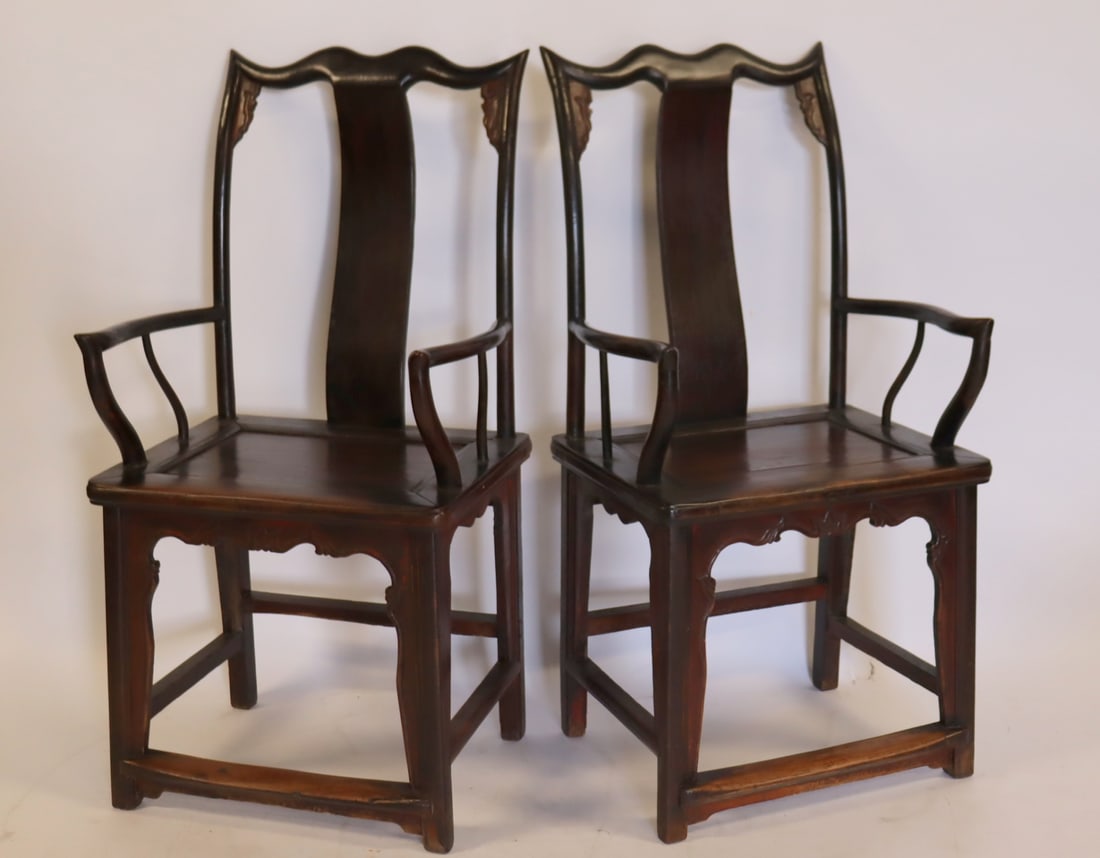 Antique Pair Of Chinese Hardwood T back Armchairs: A nice original pair with brown patina showing wear from use consistent with age and signed under seat. From a Stamford CT estate. - Dimensions: 46.25" h x 22" w x18" d.