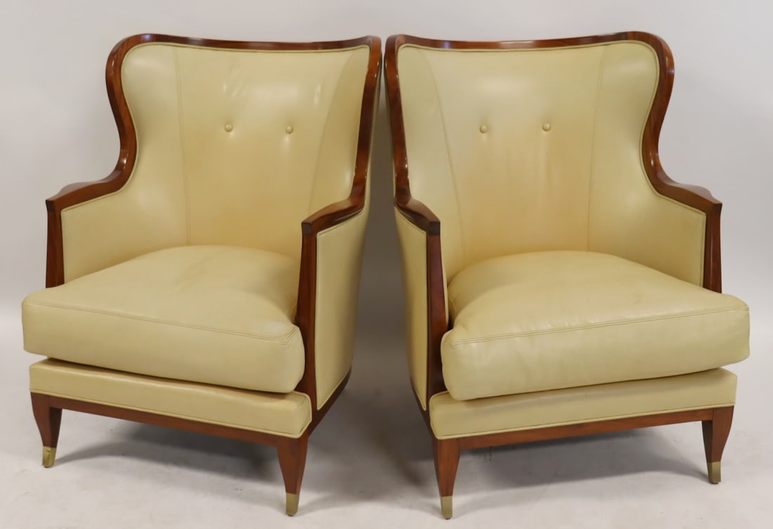 Pair of Lucien Rollin Collection Armchairs.: by William Switzer & Associates and so labeled, of broad wingback form, the back extending to closed arms, fitted with a loose seat cushion and raised on splay legs with brass caps, the upholstery