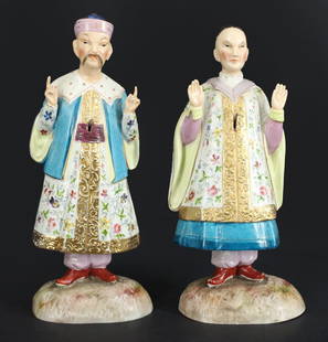 Pair of Ernst Bohne Sohne Porcelain Nodding: Figures. A pair of Ernst Bohn Sohne porcelain nodding figures depicting two Chinese inspired figures in finely decorated robes atop grassy bases. Bases stamped, "34 EBS" alongside a blue anc