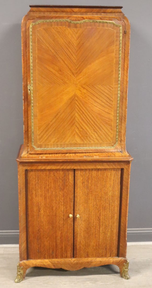 Fine Louis XVI Style Bronze Mounted Inlaid: Tambour Cabinet. Parquetry inlay on both sides, tambour doors on bottom and raised on bronze mounted feet. From a Sutton Place, NYC estate. - Dimensions: 69" x 32" x 15"